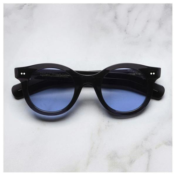 Cutler & Gross 1390 round sunglasses in black on blue