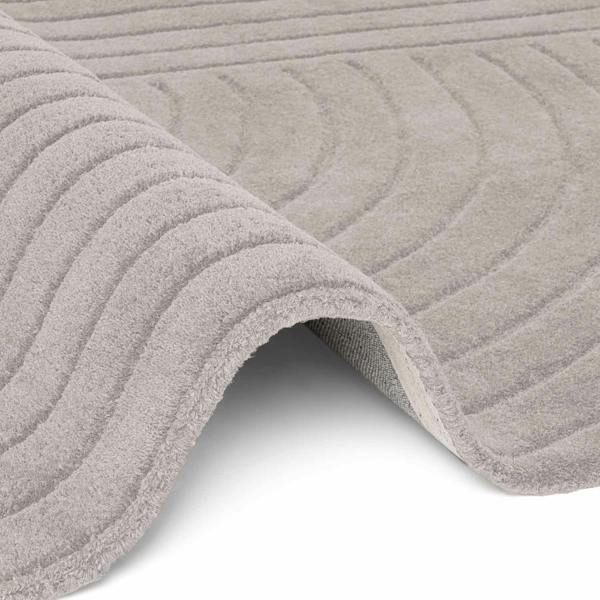 Close-up of a textured gray rug on a white background