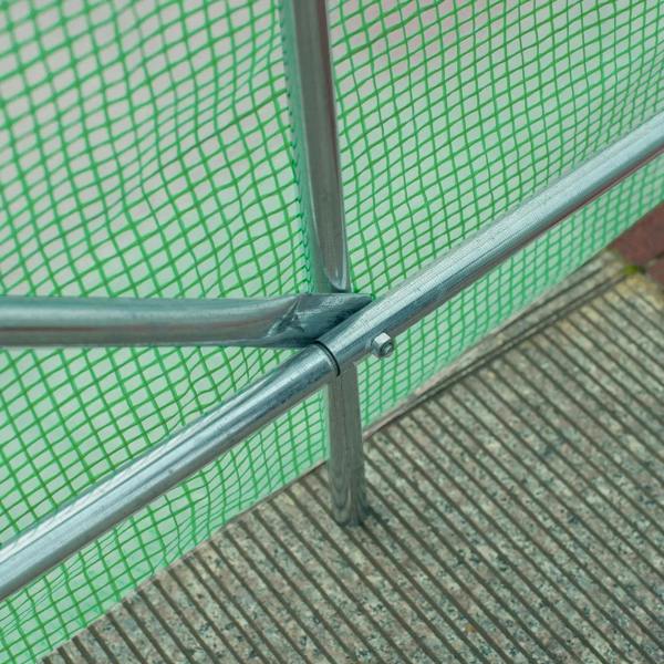 Green greenhouse corner joint with steel frame on ground, PE mesh cover