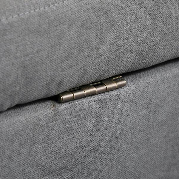 Metal hinge hardware on grey sofa seat cushion
