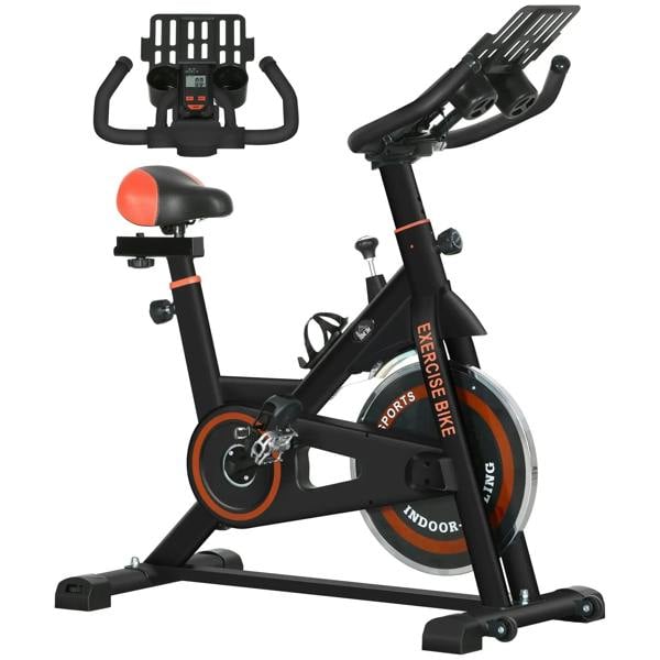 Black stationary exercise bike with orange-accent flywheel, adjustable seat and handlebars