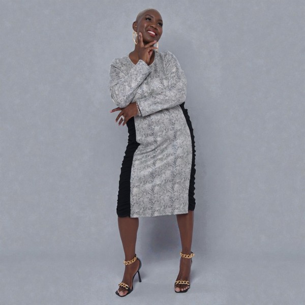 Women's Plus Size Black White Animal Print Bodycon Midi Vegan Leather Dress shown from the front, styled with black heels for a chic look.Plain Background.