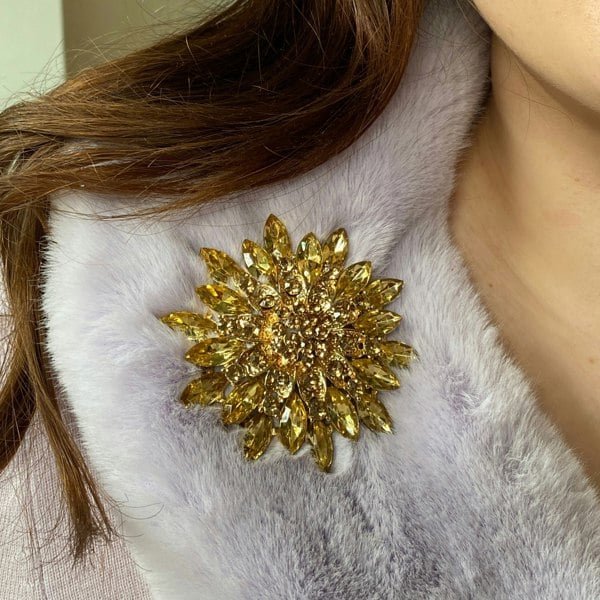 large gold flower brooch, detailed petal design, statement floral accessory, elegant gold tone brooch, vintage inspired jewellery for jackets or scarves
