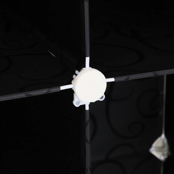 Close-up of wardrobe connector hub joining white frame bars inside a cube cabinet