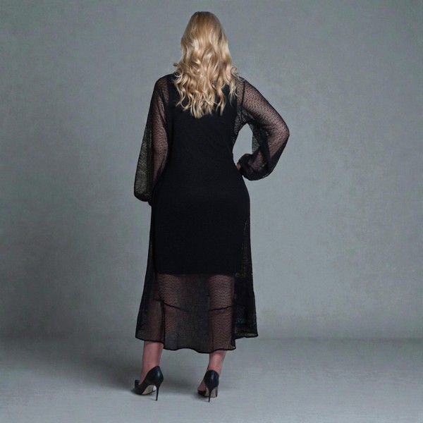 Women's Aphrodite Black Holiday Resort Dress with black undergarment, styled with black heels for a chic holiday look.