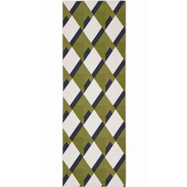 Rectangular green and white patterned rug on a white background
