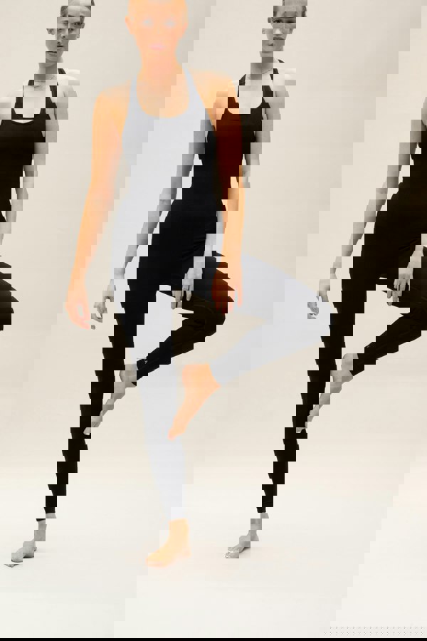 Black seamless sculpting shaping one piece bodysuit with built in shelf bra and removable pads for yoga, pilates, gym and exercise.