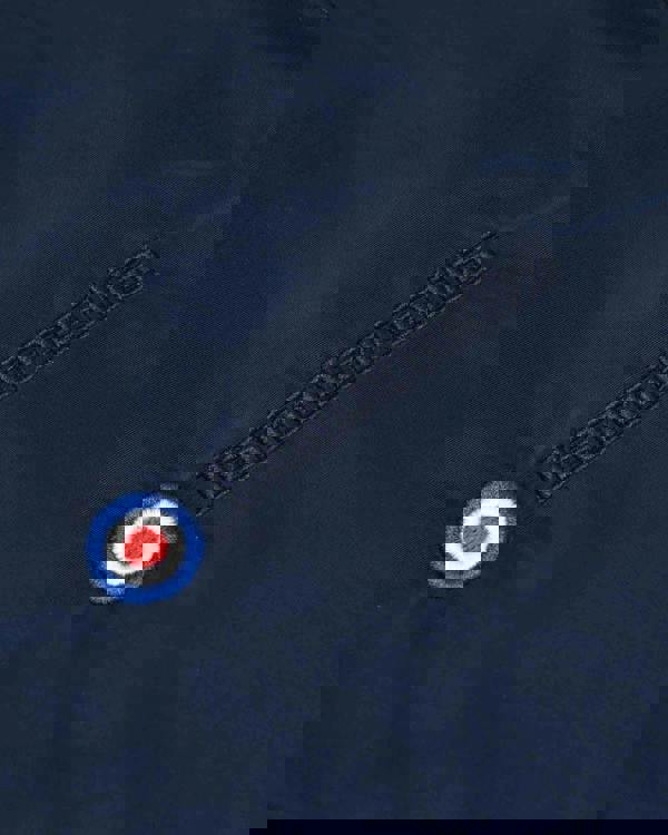 Lambretta Heaton Mens Shower-Resistant Mod Ska Hooded Lightweight Jacket Coat, close-up of fabric with embroidered Lambretta logo and a circular patch.