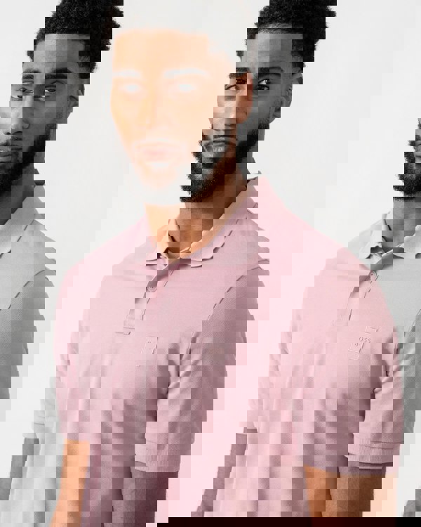 close up of a model wearing a BOSS Orange Passenger Mens Stretch-Cotton Slim-Fit Polo Shirt with Logo Patch in Light/Pastel Purple