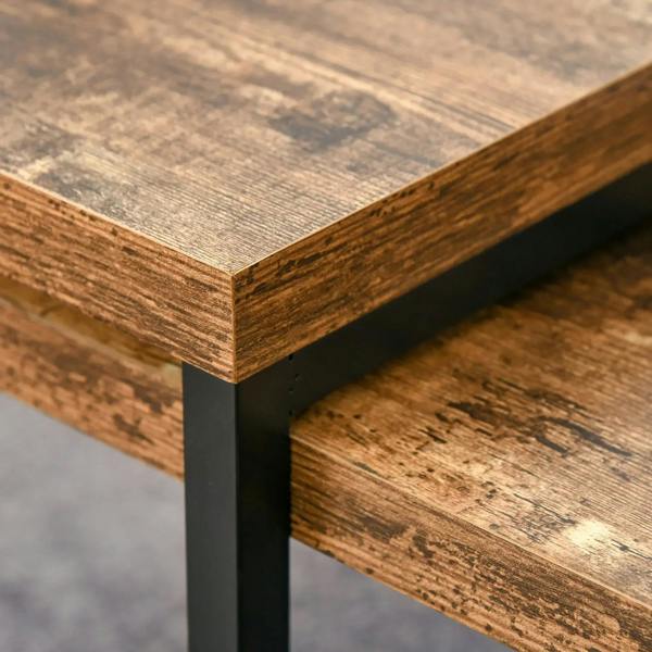 Rustic brown tabletop corner with black metal leg and lower shelf, close-up