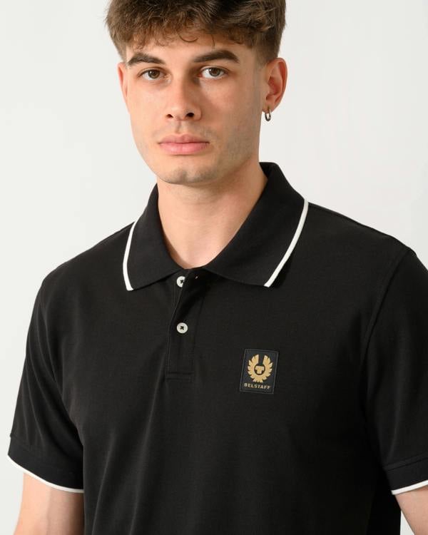 close up shot of a model wearing a Belstaff Mens Tipped Polo Shirt in Black