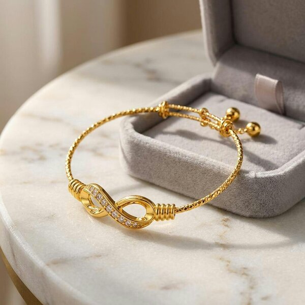 The Colourful Aura 18ct Gold Plated Infinity Crystal Adjustable Bangle Bracelet with Bell Charms