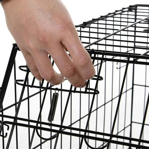 Close-up of secure latch on black wire dog crate door bar
