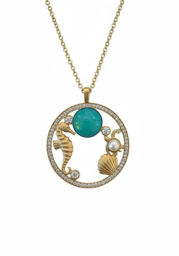 18k gold plated oceanic pendant necklace with a turquoise stone and cubic zirconia.