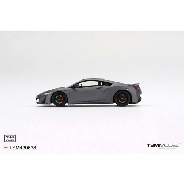 a grey sports car on a white background