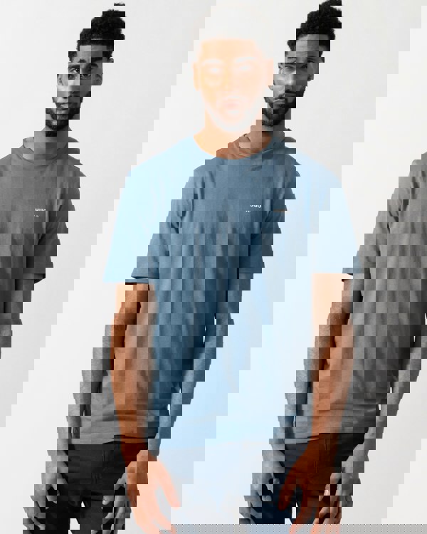 Model wearing a HUGO Dero222 Mens Cotton-Jersey T-Shirt with Logo Print in Open Blue