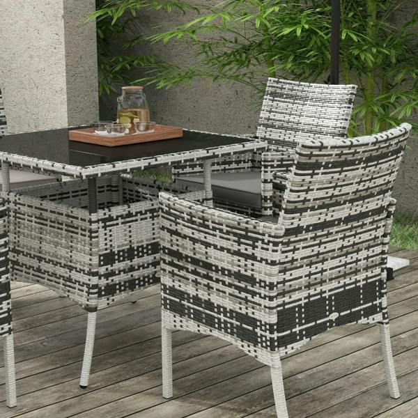 Grey rattan outdoor dining set with four armchairs, square table, and padded seat cushions