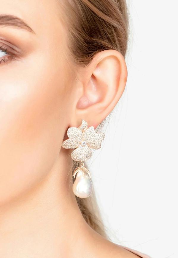 The earring worn by a model.