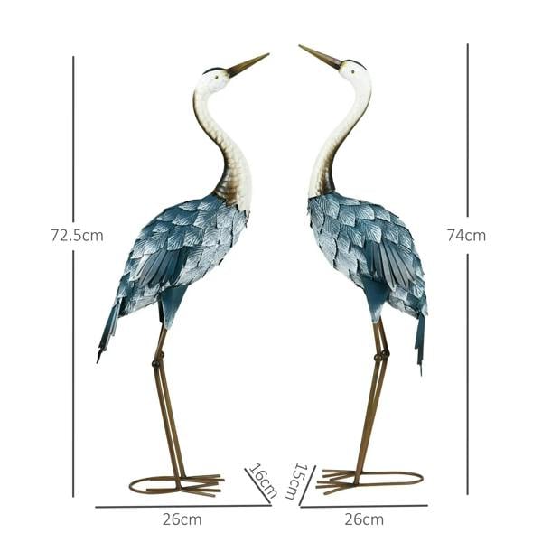 Two standing steel crane statues with white beaks, blue feather scales, gold legs and round feet