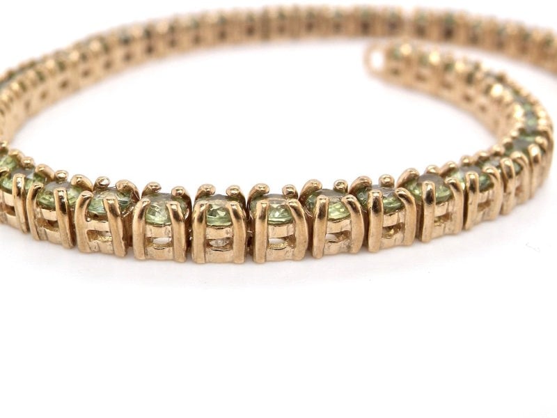 Vintage Tom A 9 carat gold peridot line bracelet