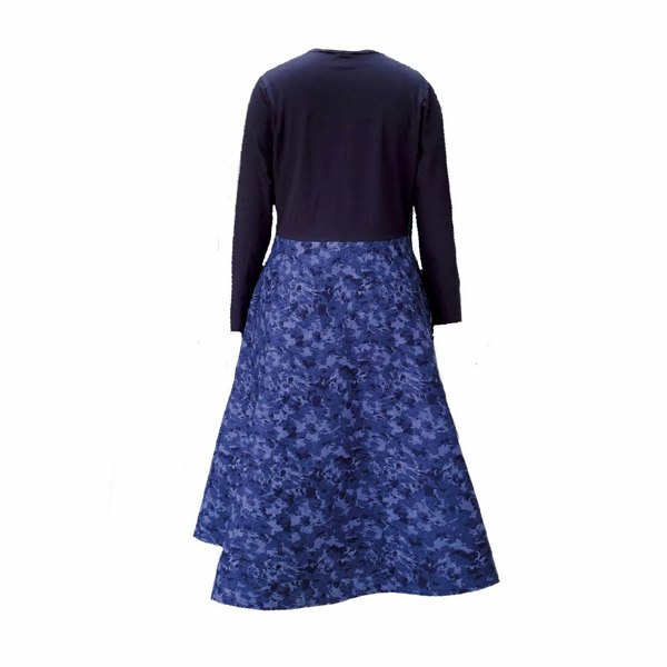 Pictured is the back of the Amiira Dress in Colbalt Waves. It is long sleeved navy top with a full patterned skirt