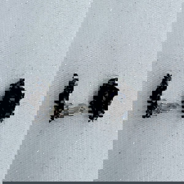 Black clip-on earrings, faceted black beads, clustered design, vintage inspired style, lightweight and comfortable, elegant statement jewellery
