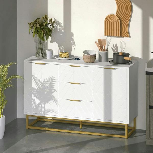 White sideboard with 3 drawers, gold bar pulls, geometric doors, raised gold frame base.