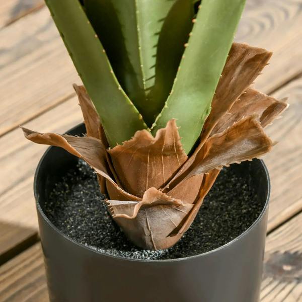 Artificial agave succulent base in black pot, brown dried moss around stems