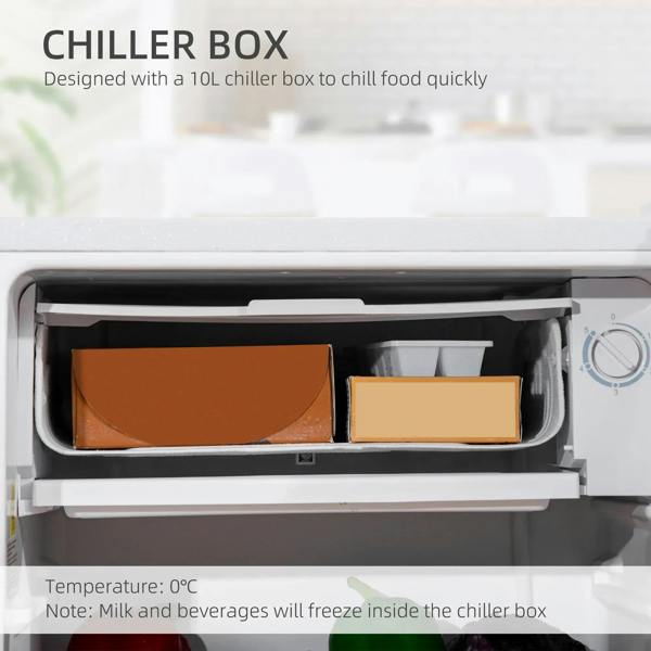 Open chiller compartment inside white mini fridge with food containers and temperature control knob.