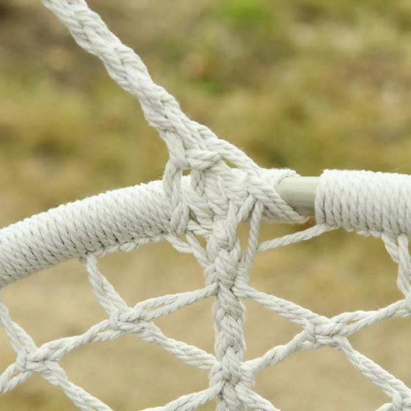 Close-up of cream macrame hammock chair rope knot and woven net seat