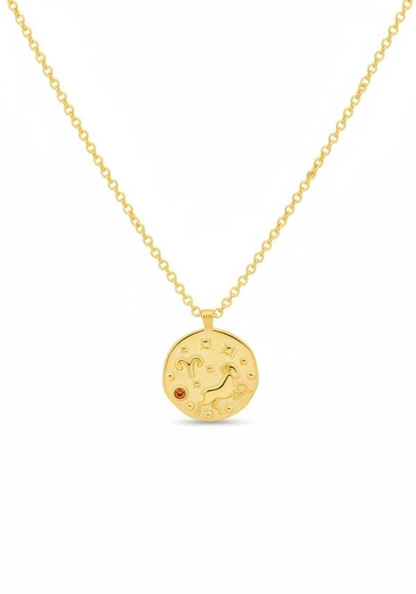 Gold necklace with a circular pendant on a white background