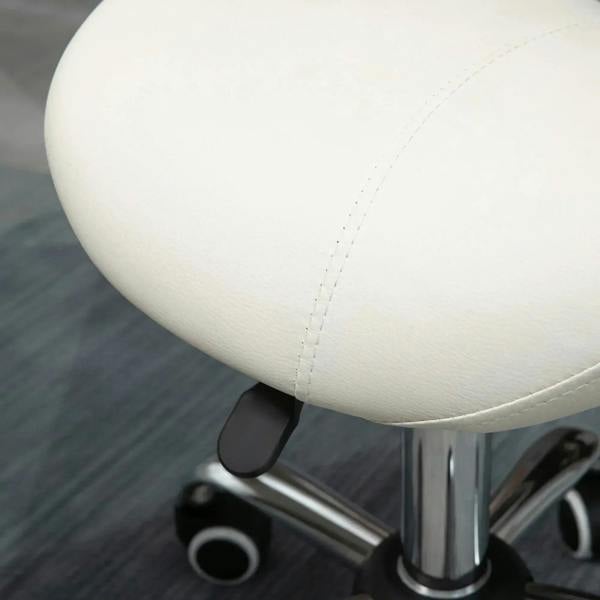 Cream padded saddle stool seat detail with stitched upholstery and rolling caster base