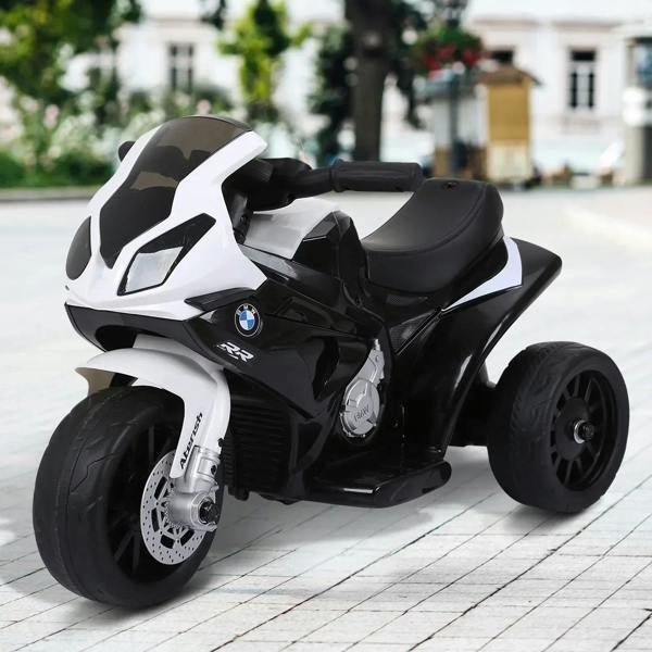 Black-and-white kids electric ride-on motorbike, front three-quarter view with thick tires.