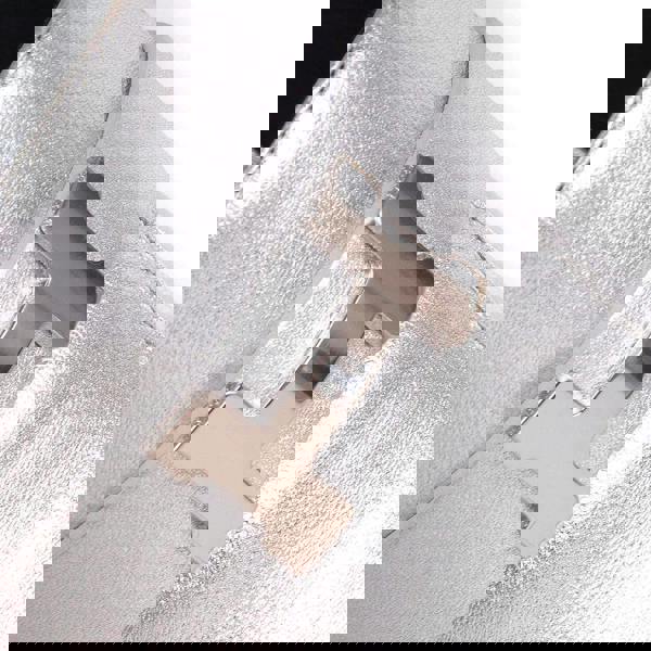 Hermes Trocadero mules in a metallic silver grained leather