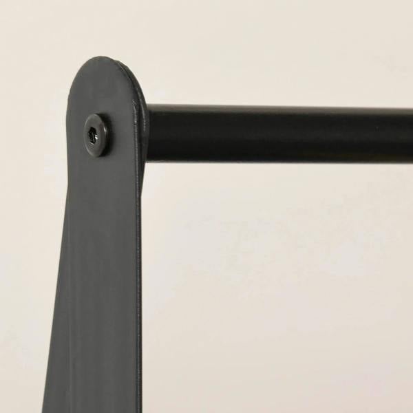 Black metal clothes rack corner leg cap and mounting hole detail
