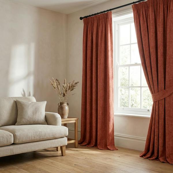 Sevilla made-to-measure curtains in Vermillion, styled in a living room