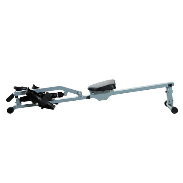Grey and black rowing machine side view with padded seat, foot straps, and handlebars