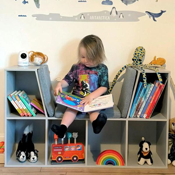 Gray kids bookcase shelf with six compartments and cushioned seat for reading