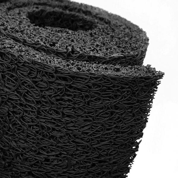 Roll of black spaghetti mat on a white background