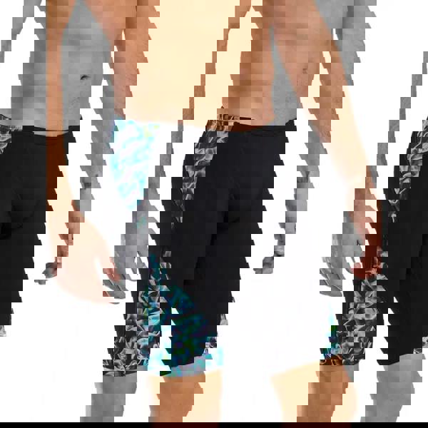 Black and teal TYR Energia Durafast Elite swim trunks with abstract design