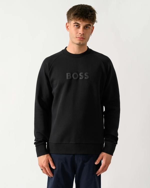model wearing a BOSS Green Salbo Mens Crew Neck Sweatshirt with Tonal Logo in Black 001