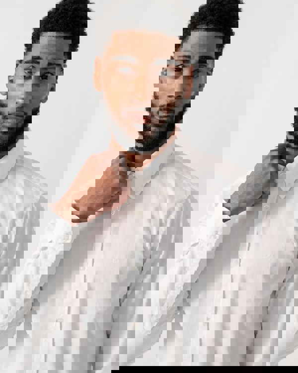 Close up of a model wearing a BOSS Orange Rickert Mens Shirt in Natural colourway