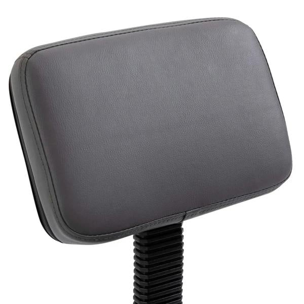 Grey padded salon chair backrest with stitched edges and textured upholstery
