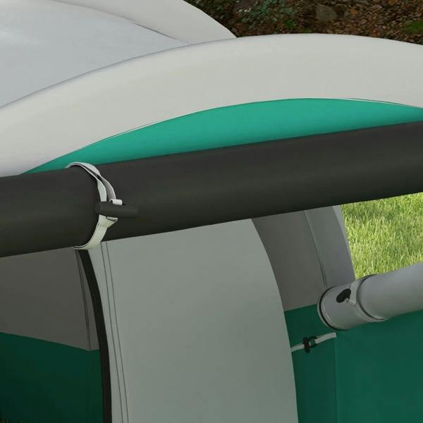 Close-up of green tent fabric and gray tunnel pole connection at the doorway side