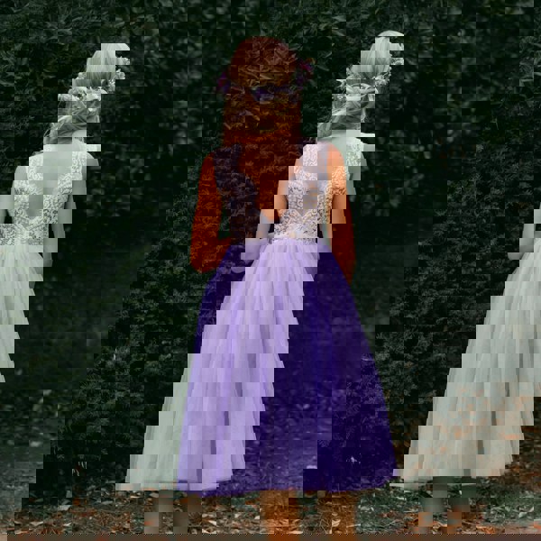 young girl wearing lilac flower girl dress