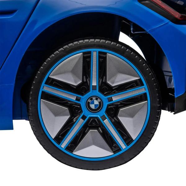 Blue kids electric ride-on car wheel with black tire and BMW logo center hub.