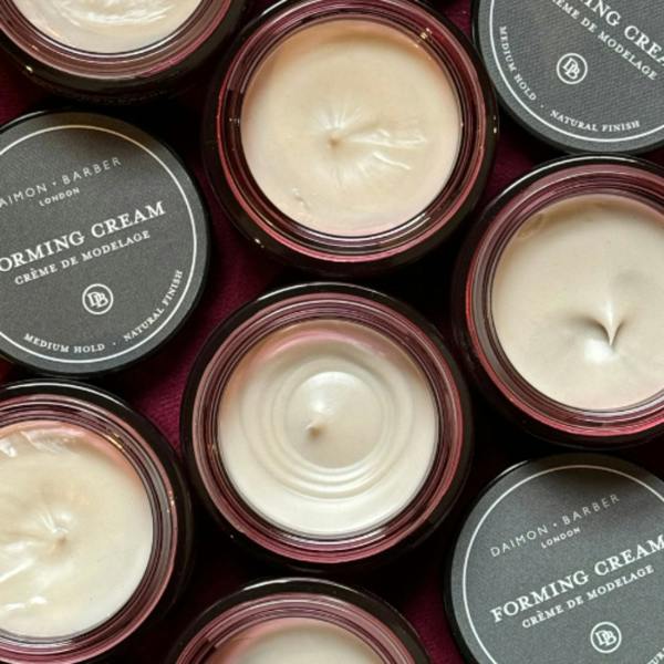 Overhead shot of open Forming Cream Jars with lids.
