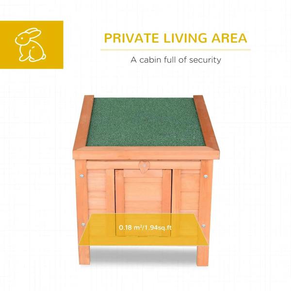 Small wooden rabbit hutch with front door and green asphalt-style roof cover