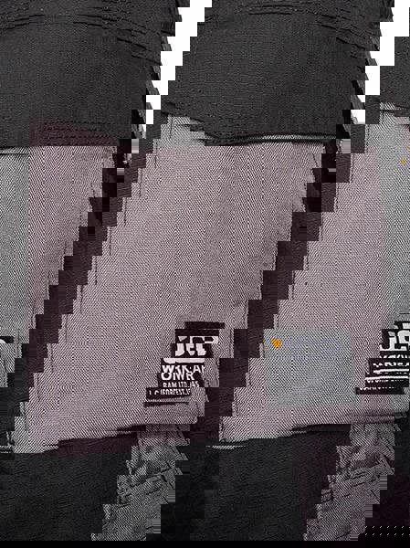 JCB Trade Plus Rip Stop Mens Multi-Pocket Cargo Work Trade Trousers - Regular Leg, close-up of the grey pocket with JCB logo and durable ripstop fabric.