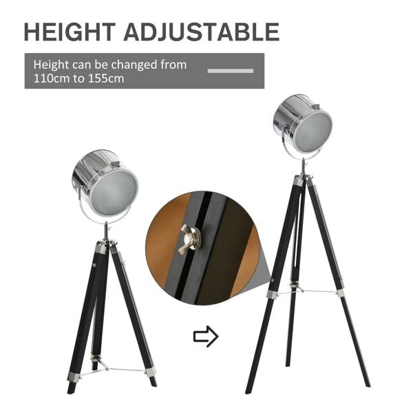 Height-adjustable chrome searchlight floor lamp on black tripod